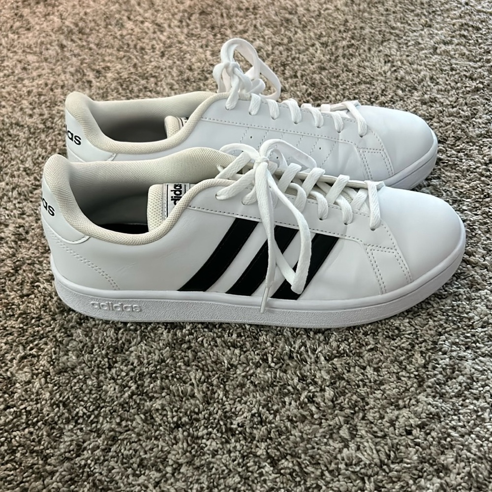 Black and white adidas tennis shoes